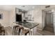 Eat in kitchen boasting granite counters, stainless steel appliances, and modern white cabinets at 8637 E Weldon Ave, Scottsdale, AZ 85251