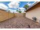 Low maintenance side yard with rock landscaping and secure fencing, providing privacy and functional space at 8637 E Weldon Ave, Scottsdale, AZ 85251