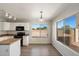 Well-lit kitchen with sleek appliances and views of the backyard at 8708 S 50Th Ln, Laveen, AZ 85339