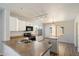 Bright kitchen features laminate floors and white cabinets at 8708 S 50Th Ln, Laveen, AZ 85339