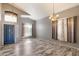 Spacious living room with high ceilings, hardwood floors, and ample natural light at 8708 S 50Th Ln, Laveen, AZ 85339
