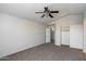 Spacious main bedroom features neutral carpet and ample closet space at 8708 S 50Th Ln, Laveen, AZ 85339