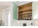 Well-organized kitchen cabinet with shelves showcasing dishware and glassware for easy access and storage at 8989 N Gainey Center Dr # 231, Scottsdale, AZ 85258