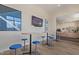 Relaxing dining area featuring a TV, tables, and a coffee station at 8989 N Gainey Center Dr # 231, Scottsdale, AZ 85258