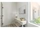 Entryway featuring a white console table, mirror, lamp, and tile floors at 8989 N Gainey Center Dr # 231, Scottsdale, AZ 85258