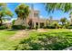 Beautiful multi-level home with mature landscaping and a lush green lawn at 8989 N Gainey Center Dr # 231, Scottsdale, AZ 85258
