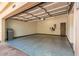Spacious garage with epoxy floors, electric car charger, and ample storage space at 8989 N Gainey Center Dr # 231, Scottsdale, AZ 85258