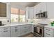Bright kitchen featuring white cabinets, stainless appliances, and quartz counters at 8989 N Gainey Center Dr # 231, Scottsdale, AZ 85258