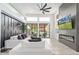 Open-concept living room with a modern fireplace, large windows, and stylish furnishings, perfect for entertaining at 8989 N Gainey Center Dr # 231, Scottsdale, AZ 85258