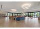Bright lounge area with modern furnishings, large windows, and access to outdoor views at 8989 N Gainey Center Dr # 231, Scottsdale, AZ 85258