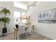 Office with light-colored wood desk, modern chairs, and an abundance of natural light at 8989 N Gainey Center Dr # 231, Scottsdale, AZ 85258