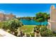 Scenic view of the pond, landscaped greenery, and blue sky from the patio at 8989 N Gainey Center Dr # 231, Scottsdale, AZ 85258