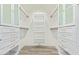 Custom walk-in closet featuring white cabinetry and drawers, providing ample storage and organization at 8989 N Gainey Center Dr # 231, Scottsdale, AZ 85258