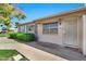 Charming single-story home featuring manicured landscaping, security door, and beautiful mature shade tree at 903 N Revere St # F, Mesa, AZ 85201