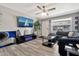 Bright living area with wood-look flooring, stylish decor, and plenty of natural light at 903 N Revere St # F, Mesa, AZ 85201