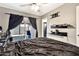 Inviting primary bedroom boasting dark wood-look floors, patio access, and contemporary decor at 903 N Revere St # F, Mesa, AZ 85201