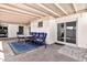 Covered patio area with tiled floor, providing shade and seating, great for outdoor relaxation at 903 N Revere St # F, Mesa, AZ 85201
