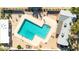 Aerial view of a sparkling pool surrounded by lounge chairs and well-maintained landscaping at 903 N Revere St # F, Mesa, AZ 85201
