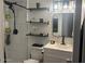 Bathroom featuring floating shelves and a modern shower system at 948 S Alma School Rd # 115, Mesa, AZ 85210