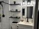 Modern bathroom with black fixtures, floating shelves, and a sleek vanity at 948 S Alma School Rd # 115, Mesa, AZ 85210