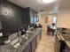 Modern kitchen featuring granite countertops, stainless steel appliances, and stylish backsplash at 948 S Alma School Rd # 115, Mesa, AZ 85210