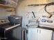 Functional laundry area with modern washer and dryer, complemented by ample storage solutions at 948 S Alma School Rd # 115, Mesa, AZ 85210