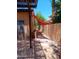 Side yard area featuring a pergola and shade sail at 11233 W Olive Dr, Avondale, AZ 85392