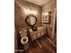 Bathroom featuring a bowl sink, granite countertops, and wooden style tiling at 11233 W Olive Dr, Avondale, AZ 85392