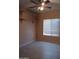 Bedroom with tile flooring, built-in shelving, and natural light at 11233 W Olive Dr, Avondale, AZ 85392