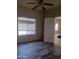 Bedroom with wood-look tile flooring and natural light at 11233 W Olive Dr, Avondale, AZ 85392