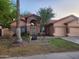 Charming single story home with a stone archway entry and attached two car garage at 11233 W Olive Dr, Avondale, AZ 85392