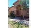 Charming single story home with an arched stone entryway and well maintained front yard at 11233 W Olive Dr, Avondale, AZ 85392