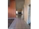 Hallway view featuring decorative tiled floors and access to the living room and kitchen at 11233 W Olive Dr, Avondale, AZ 85392