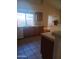 Bright kitchen with window above sink and tile flooring at 11233 W Olive Dr, Avondale, AZ 85392