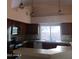 This kitchen features updated cabinetry, tile countertops and modern stainless steel appliances at 11233 W Olive Dr, Avondale, AZ 85392