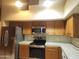Kitchen with stainless steel appliances, lots of natural light, and light colored counter tops at 11233 W Olive Dr, Avondale, AZ 85392