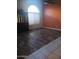 Spacious living room featuring decorative flooring and a high vaulted ceiling at 11233 W Olive Dr, Avondale, AZ 85392