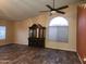 Spacious living room boasts dark wood-look floors, ceiling fan, and natural light at 11233 W Olive Dr, Avondale, AZ 85392