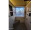 Walk-in shower with tiled walls, a glass window, and stone flooring at 11233 W Olive Dr, Avondale, AZ 85392