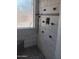 Modern shower featuring stylish tile work, rainfall shower head, and convenient storage niches at 11233 W Olive Dr, Avondale, AZ 85392