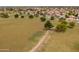 An aerial view showing a large grassy park surrounded by a residential area and mature trees at 1150 E Tyson St, Chandler, AZ 85225