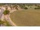 An aerial view captures a lush green park with walking paths and scattered trees surrounded by a residential neighborhood at 1150 E Tyson St, Chandler, AZ 85225