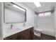 Bathroom featuring double sinks, wood flooring, and modern fixtures at 1150 E Tyson St, Chandler, AZ 85225