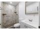 Updated bathroom with tiled shower and vanity with sink at 1150 E Tyson St, Chandler, AZ 85225