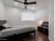 Cozy bedroom with wood floors, ceiling fan, and large window at 1150 E Tyson St, Chandler, AZ 85225