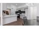 Clean, well-lit kitchen with wood flooring, gray cabinets and black backsplash at 1150 E Tyson St, Chandler, AZ 85225