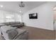 Spacious living area with hardwood floors and a comfortable gray sofa at 1150 E Tyson St, Chandler, AZ 85225