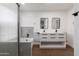 Modern main bathroom featuring dual sinks, new fixtures, and a marble tile shower at 1150 E Tyson St, Chandler, AZ 85225