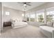 Bright bedroom with large windows and a neutral color palette at 11818 W Luxton Ln, Avondale, AZ 85323