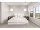 Well-lit bedroom with neutral carpet, large windows, and modern decor at 11818 W Luxton Ln, Avondale, AZ 85323